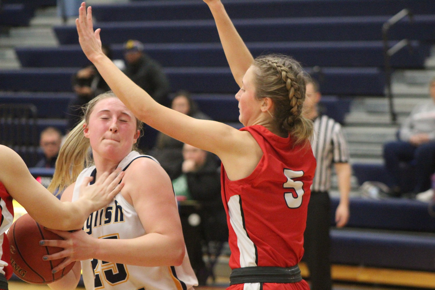 Highland's Sarah Burton puts some defensive pressure on Kennedy Axmear of English Valleys.